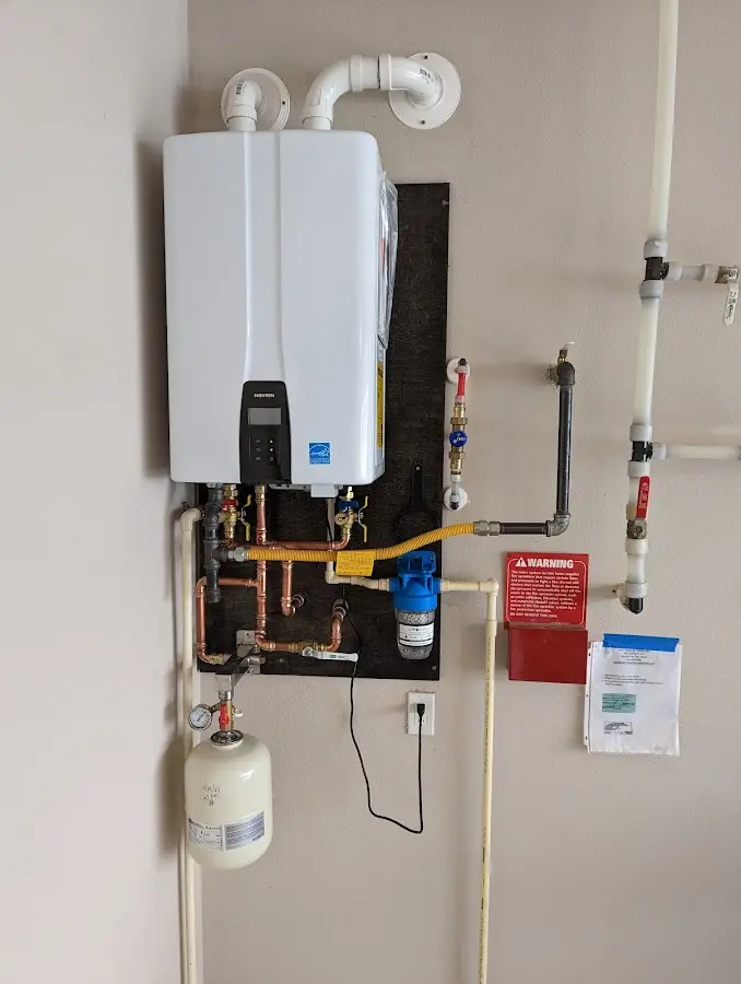 Professional plumber installing copper piping in a Chillum home